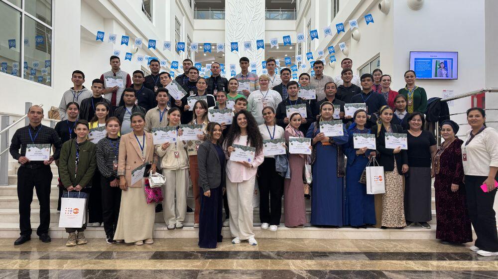 UNFPA volunteers received a certificate of participation in a debate to promote gender equality.